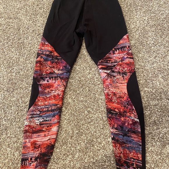 Cute high rise, full length Lululemon leggings with sections of pink pattern. - Picture 3 of 4
